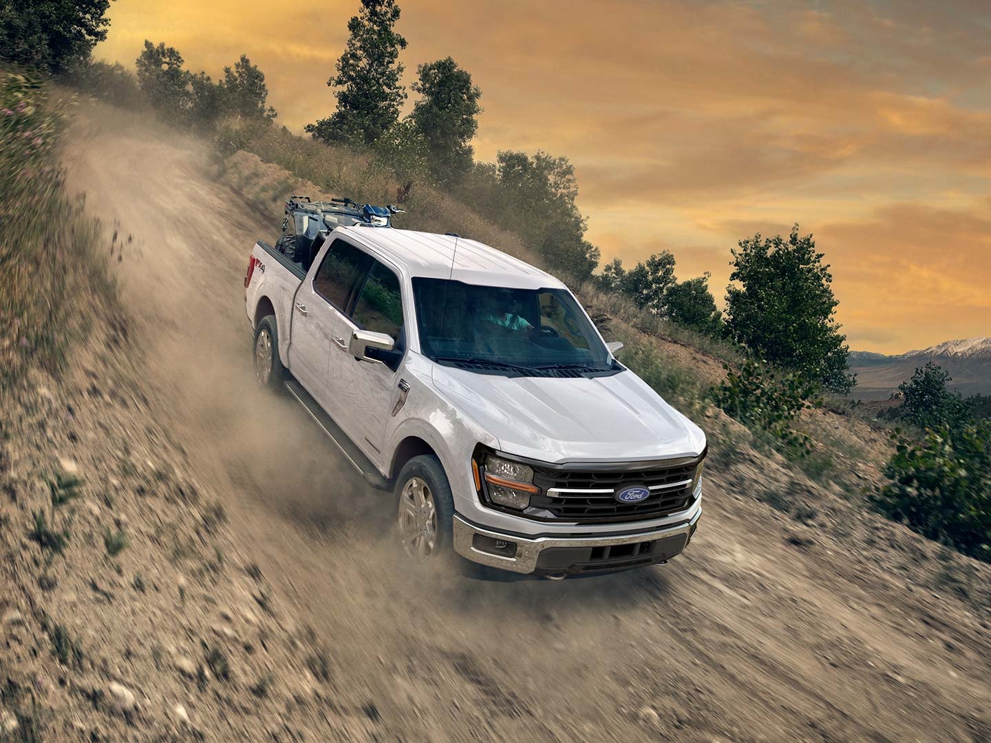 2024 Ford F150® PowerBoost® Hybrid pickup being driven on an open road