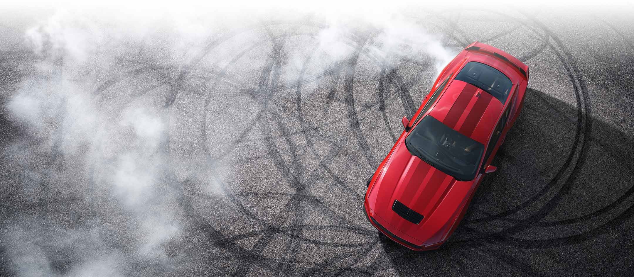Overhead view of a 2024 Ford Mustang® model with tire tracks on pavement | Way Scarff Ford Auburn in Auburn WA