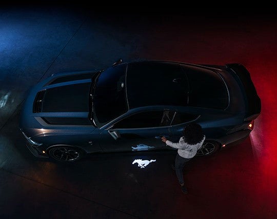 2024 Ford Mustang® Dark Horse™ model with a driver approaching the vehicle | Way Scarff Ford Auburn in Auburn WA