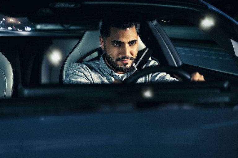 Person sitting in the driver’s seat of a parked 2024 Ford Mustang® coupe | Way Scarff Ford Auburn in Auburn WA