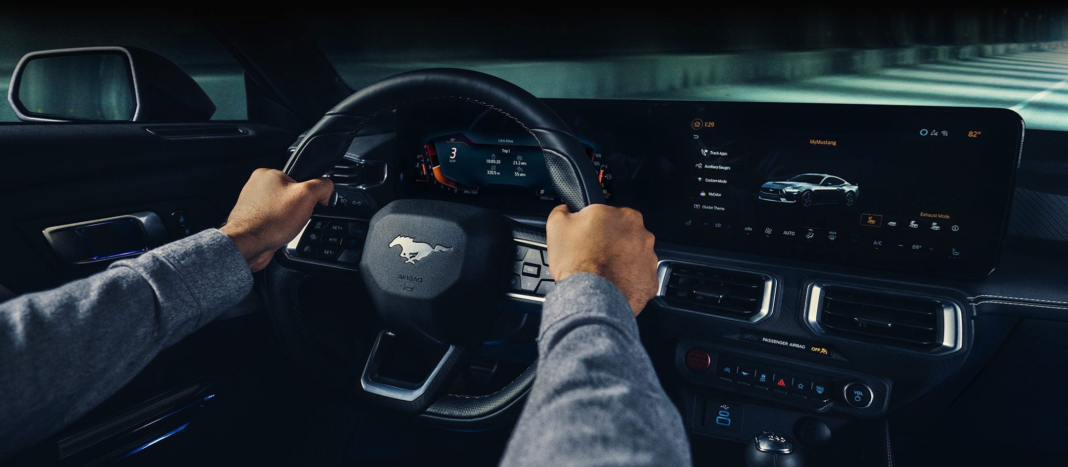 A 2024 Ford Mustang® model interior with a person driving | Way Scarff Ford Auburn in Auburn WA